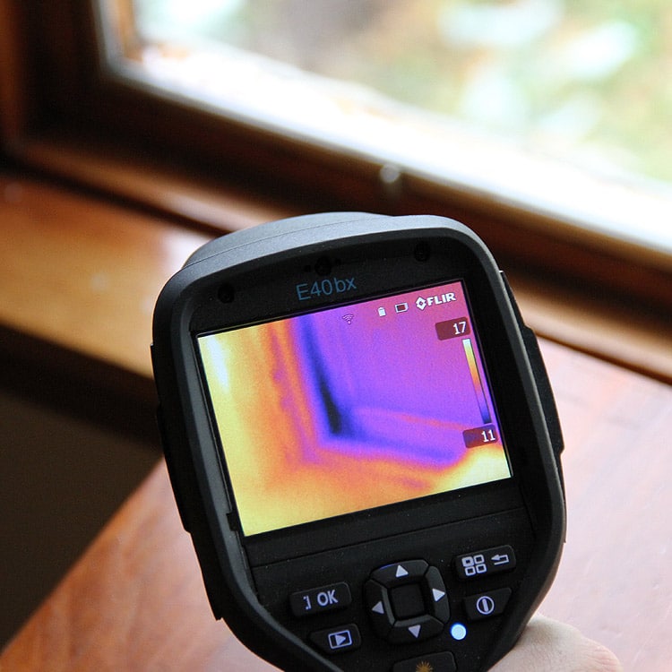 Flir camera measuring residential energy efficiency indoors